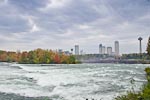 Rapids immediately upstream from American Falls.  The Canadian city of Niagara Falls is in the background on the other side of the gorge
								on the right and Goat Island is on the left.